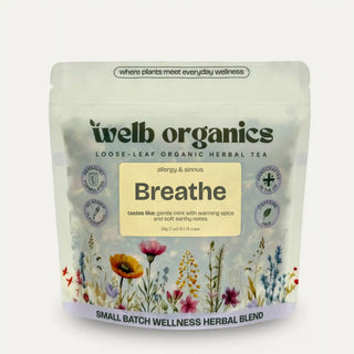 welb organics Healer herbal tea package with floral design on a light gray background
