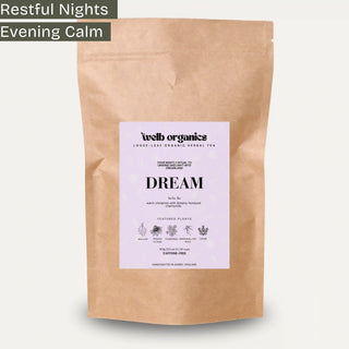 Kraft paper tea bag with a label for 'Dream' tea from webb organics on a white background.