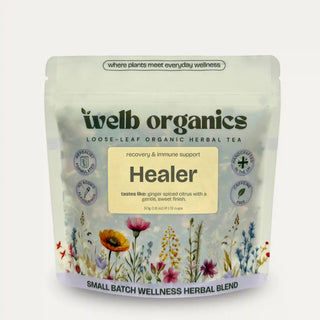 welb organics Healer herbal tea package with floral design on a light grey background