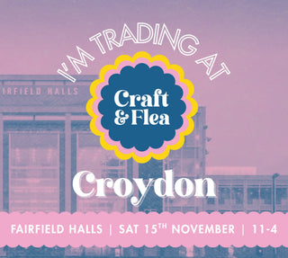 Advertisement for a craft and flea event at Croydon with a building in the background.