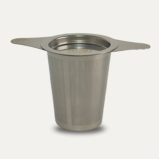 Stainless steel tea on a neutral background