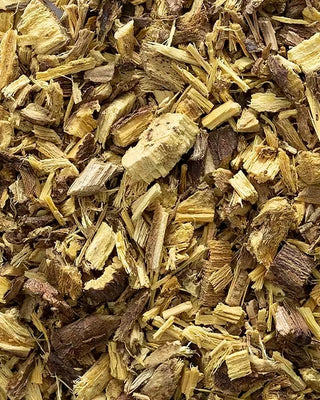 Close-up of dried liquorice roots with a focus on texture and color.