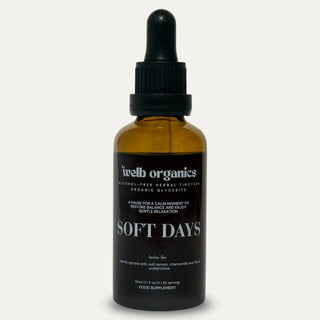Brown glass bottle with dropper labeled 'Soft Days' on a neutral background
